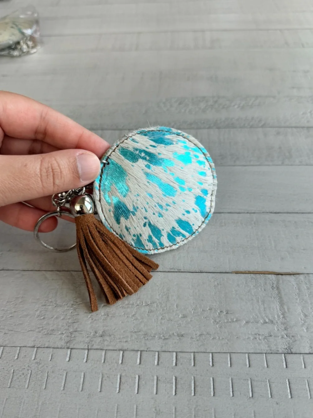 Western Acid Wash Round Turquoise & White Haircalf Keychain with Brown Tassel